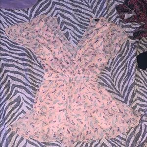 A nude with rose romper